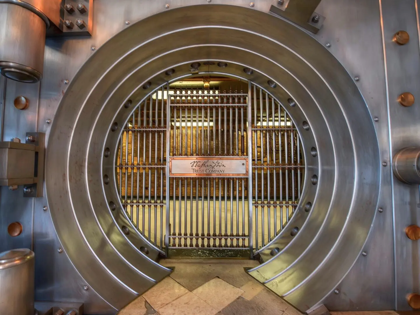 A large metal door with bars on the side.